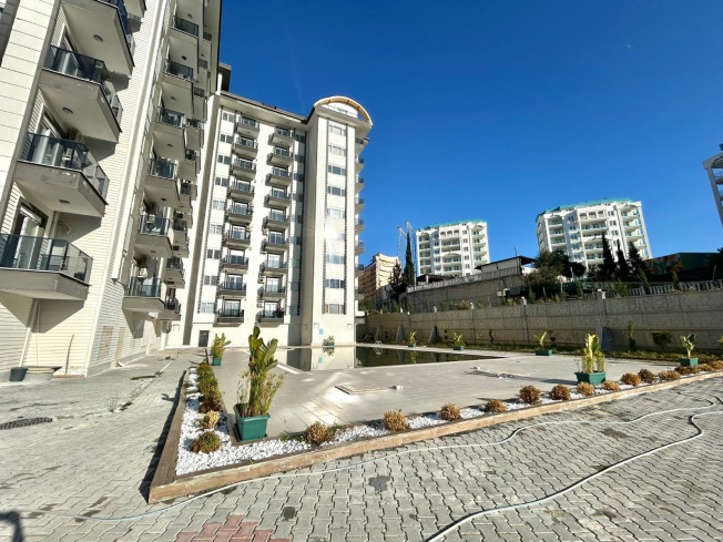 Новая 1+1 в Авсалларе с видом на город и природное окружение