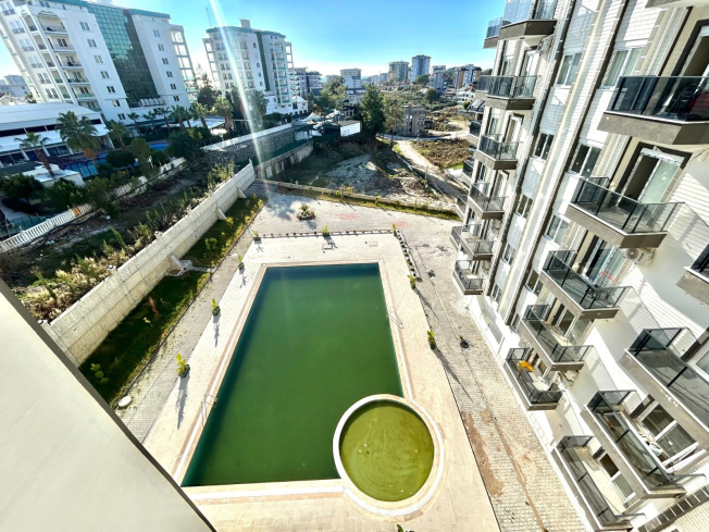 Новая 1+1 в Авсалларе с видом на город и природное окружение