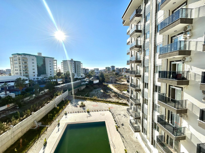 Новая 1+1 в Авсалларе с видом на город и природное окружение