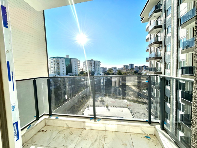 Новая 1+1 в Авсалларе с видом на город и природное окружение