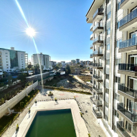 Новая 1+1 в Авсалларе с видом на город и природное окружение