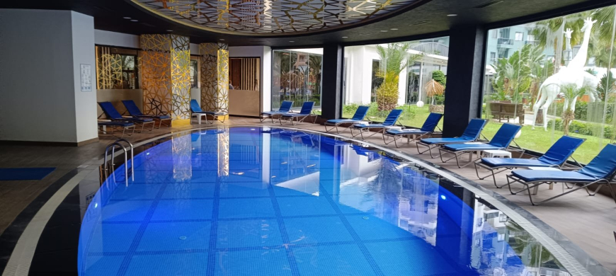 Комфортная квартира с курортной атмосферой для жизни и дохода в Махмутларе