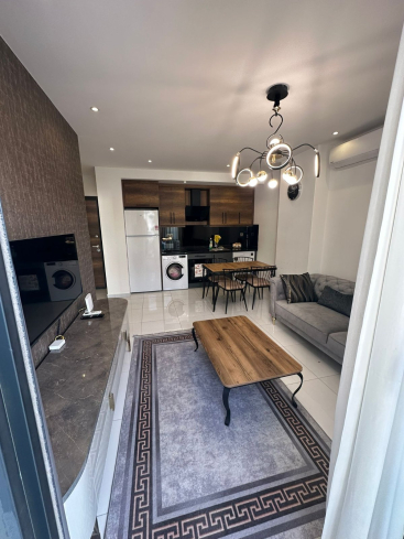 Комфортная квартира с курортной атмосферой для жизни и дохода в Махмутларе