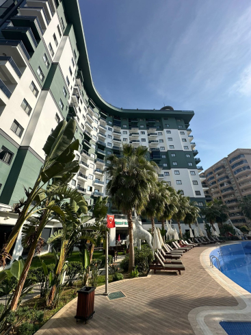 Комфортная квартира с курортной атмосферой для жизни и дохода в Махмутларе