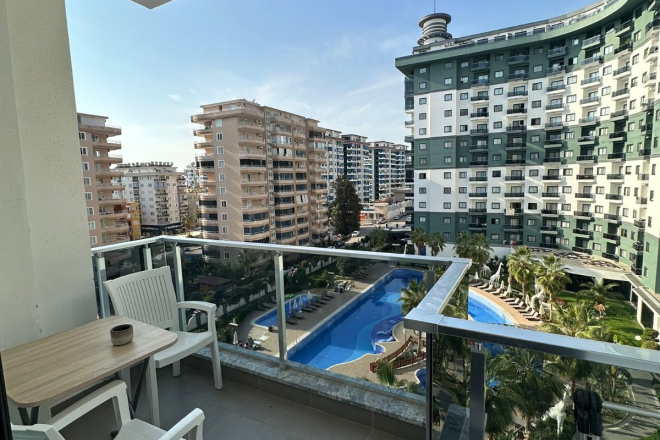 Комфортная квартира с курортной атмосферой для жизни и дохода в Махмутларе