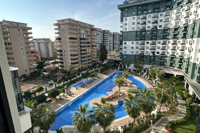 Комфортная квартира с курортной атмосферой для жизни и дохода в Махмутларе