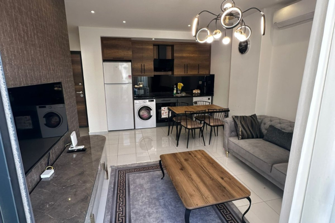 Комфортная квартира с курортной атмосферой для жизни и дохода в Махмутларе