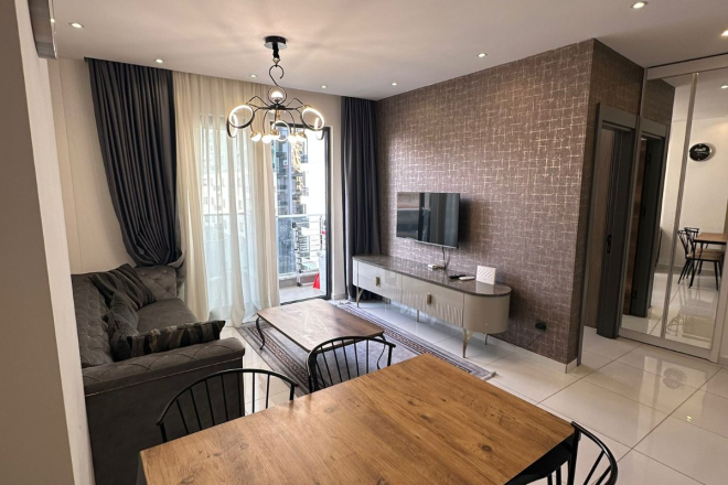 Комфортная квартира с курортной атмосферой для жизни и дохода в Махмутларе