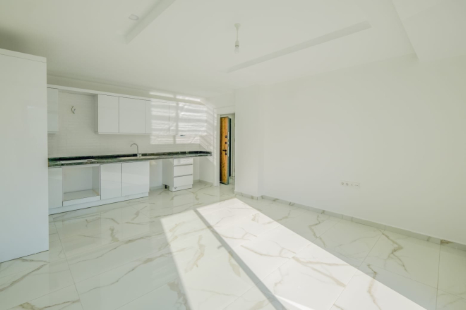 Светлая квартира с панорамными видами в новом доме Махмутлара для жизни и аренды