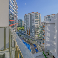 Светлая квартира с панорамными видами в новом доме Махмутлара для жизни и аренды