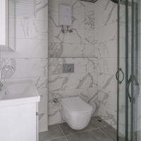 Светлая квартира с панорамными видами в новом доме Махмутлара для жизни и аренды