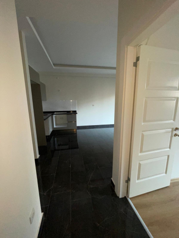 Новая квартира 1+1 с полной инфраструктурой в Махмутларе для жизни и дохода