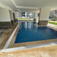 Новая квартира 1+1 с полной инфраструктурой в Махмутларе для жизни и дохода