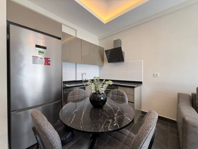 Современная 1+1 квартира в Махмутларе с расширенной инфраструктурой для отдыха