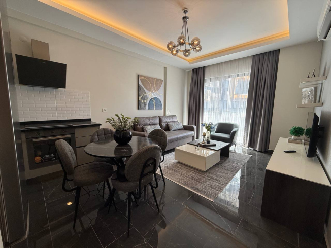 Современная 1+1 квартира в Махмутларе с расширенной инфраструктурой для отдыха