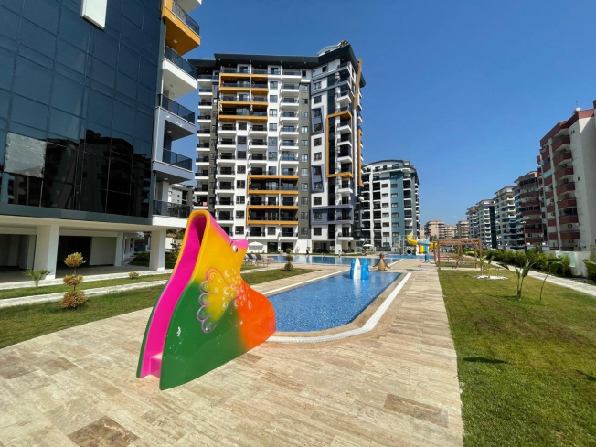 Современная 1+1 квартира в Махмутларе с расширенной инфраструктурой для отдыха