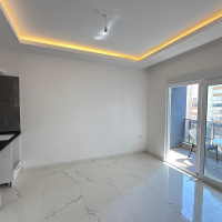 Новая 1+1 квартира в Махмутларе — 500 м до моря и центр в шаговой доступности