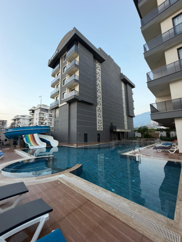 Купить меблированную квартиру 1+1 с видом на море в Каргыджаке — 55 м², 300 м до пляжа